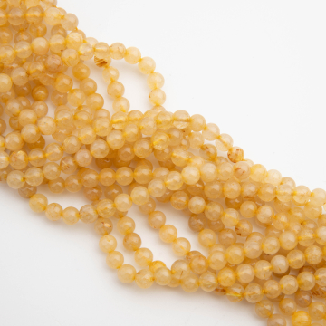 Kryształ górski ze złotym rutylem kulka gładka 6mm