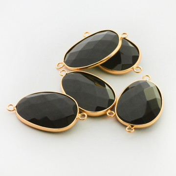 Onyks owal fasetowany w okuciu łącznik 40mm