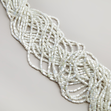 Kryształki słupki fasetowane ceramic white AB 4,5x8,5mm