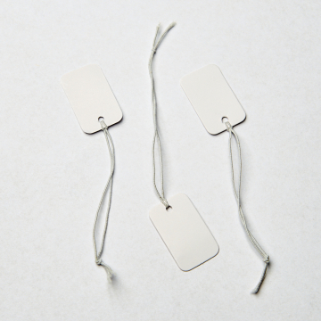 Metka z gumką do bizuterii biała 15x25mm