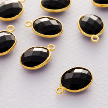 Onyks owal fasetowany zawieszka w okuciu pozłacanym AG925  14x10mm