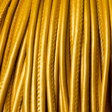 Rzemień szyty metallic gold 4mm