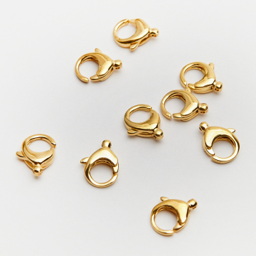 Karabiczyk ozdobny ze stali chirurgicznej w kolorze złotym 12mm