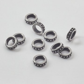 Przekładka oponka w kropeczki do męskich bransoletek ze stali chirurgicznej w kolorze srebrnym 9x3mm