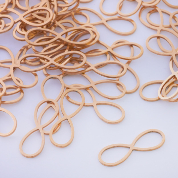 Baza geometryczna ze stali chirurgicznej znak nieskończoności w kolorze złotym 26x9mm