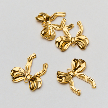 Zawieszka ze stali chirurgicznej bogata kokardka w kolorze złotym 24mm PVD