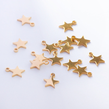 Zawieszka ze stali chirurgicznej gwiazdka w kolorze złotym 9,5mm