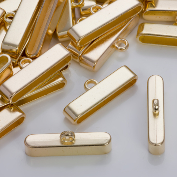 Szeroka końcówka do wielu rzemieni w złotym kolorze 37,5x7,5mm