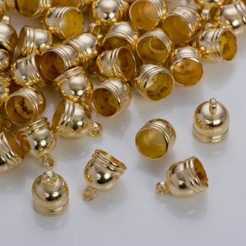 Końcówki do rzemieni i sznurków beczułki w złotym kolorze 9,5 mm