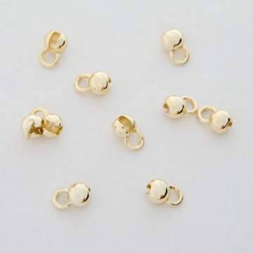 Końcówki kuleczki zaciskowe do wykańczania naszyjników i bransoletek z mosiądzu w kolorze złotym 5x1,2mm