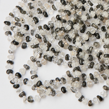 Kryształ górski z rutylem oponka nieregularna 3x8mm Kryształ górski z rutylem oponka nieregularna 3x8mm