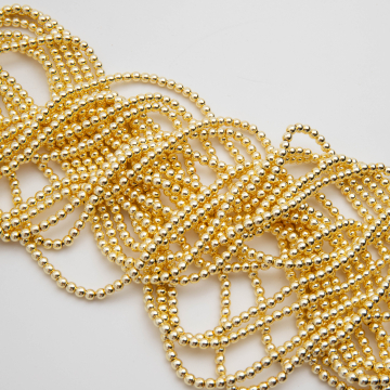 Hematyt kulka gładka light gold 3mm - na sznurze