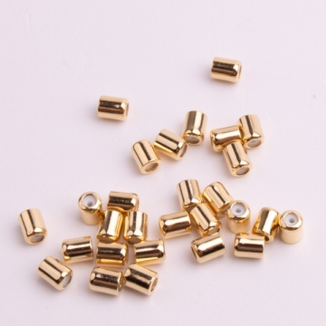 Zapięcie stoper z silikonem do cienkich sznureczków walec złoty 5x4mm