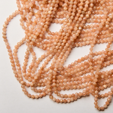 Kamień słoneczny kulka fasetowana 4mm - na sznurze