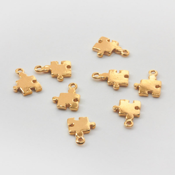 Srebrna zawieszka do bransoletek mini puzzel AG925 pozłacana 11x8mm