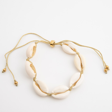 Bransoletka z muszlami kauri na złotym sznurku