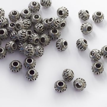 Koralik z ciemnego srebra z wyciętymi zawijasami 11,5mm