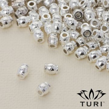 Przekładka beczułka ze wzorkiem w srebrnym kolorze 4.5x5.5mm Przekładka beczułka ze wzorkiem w srebrnym kolorze 4.5x5.5mm