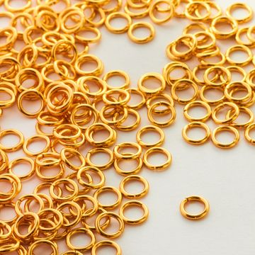 Kółeczka zaciskowe ze stali chirugicznej w kolorze złotym 6x0,9mm PVD