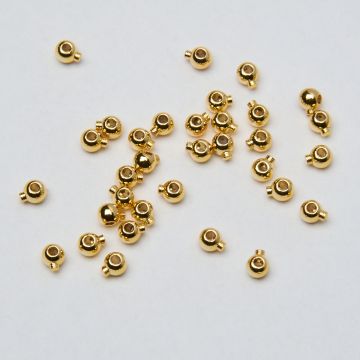 Zacisk w kształcie kulki do nici, linek, sznureczków mosiądz pozłacany 14k Au585 0,8mm