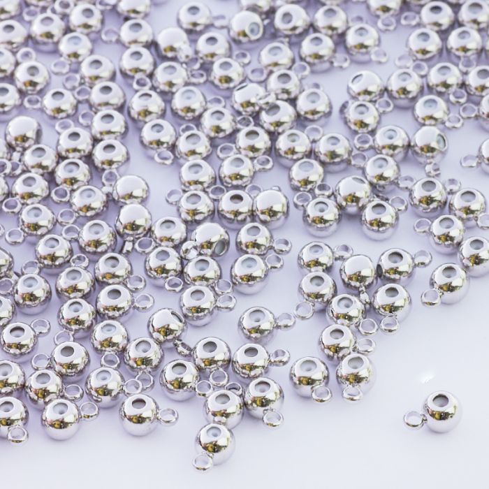 Zapięcie stoper z silikonem do cienkich sznureczków srebrne kulki z krawatką 6x4mm Zapięcie stoper z silikonem do cienkich sznureczków srebrne kulki z krawatką 6x4mm