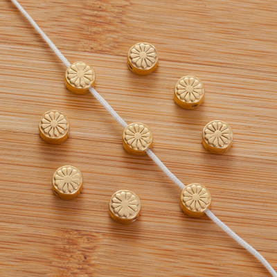 Srebrny koralik krążek kwiatek AG925 pzłacany 6.5mm