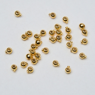 Zacisk w kształcie kulki do nici, linek, sznureczków z mosiądzu w kolorze złotym 0,8mm